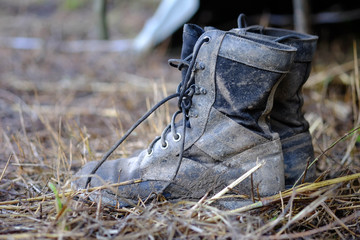Black shoes of soldiers stained with mud