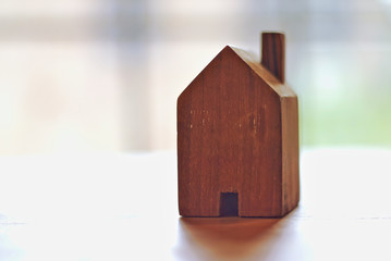 Obraz na płótnie Canvas mini house toy vinage style on natural light