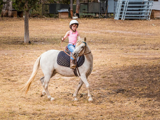 Young child learning to ride in the Upper Hunter Valley, NSW, Australia.