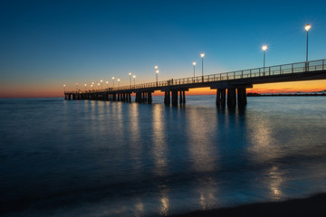 Fototapeta na wymiar Sunset at Massa Pier Italy