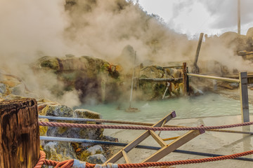 Owakudani hot spring pond with misty and active sulfur vents is popular scenic views, volcano...
