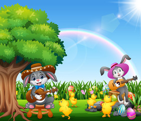 Cute bunnies relax playing guitar and surrounded by chicks