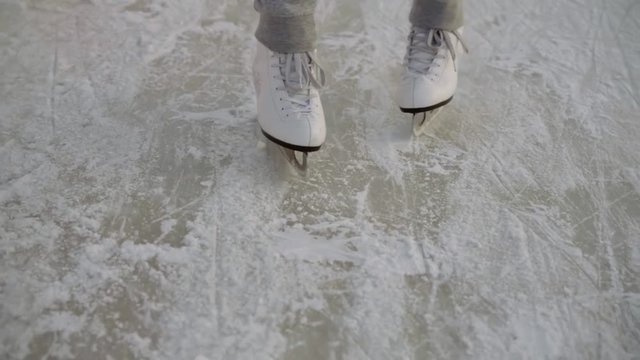 Close-up shot of a man on ice in winter, ice skating.