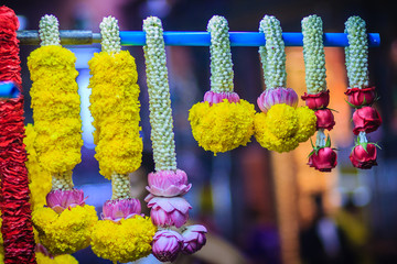 Colorful marigold flower garlands for hindu religious ceremony. Garland of indians for worship goddess in the florist shop nearby Sri Maha Mariamman Temple, Silom, Bangkok, Thailand.
