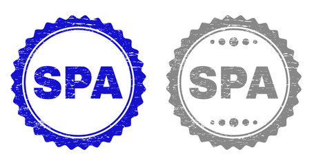 Grunge SPA stamp seals isolated on a white background. Rosette seals with distress texture in blue and gray colors. Vector rubber stamp imprint of SPA text inside round rosette.