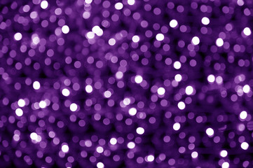 abstract blurred glowing light particles of shades of purple