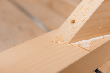 Wooden details. Details glued to each other. Carpentry workshop.