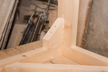 Wooden details. Details glued to each other. Carpentry workshop.