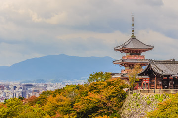 View of Kyoto city from Kiyomizu temple with dramatic cloudy sky on background.