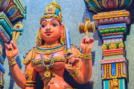 Colorful night view of indian gods sculpture at Sri Maha Mariamman Temple, also known as Maha Uma Devi temple, the public hindu temple in Silom, Bangkok, Thailand. It known as Wat Khaek Silom.