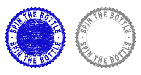 Grunge SPIN THE BOTTLE stamp seals isolated on a white background. Rosette seals with distress texture in blue and gray colors.