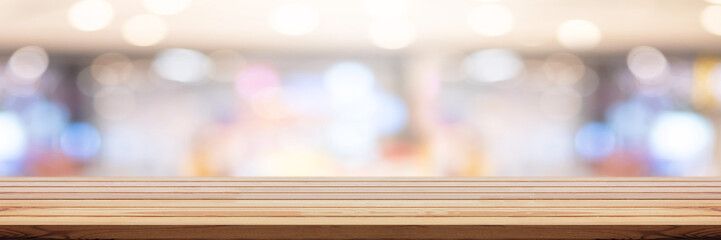 wooden pine table on top over blur background, can be used mock up for montage products display or design layout.