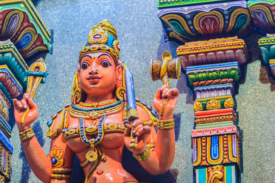 Colorful night view of indian gods sculpture at Sri Maha Mariamman Temple, also known as Maha Uma Devi temple, the public hindu temple in Silom, Bangkok, Thailand. It known as Wat Khaek Silom.