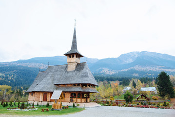 Fototapeta na wymiar Small wooden church in beautiful mountains in Europe