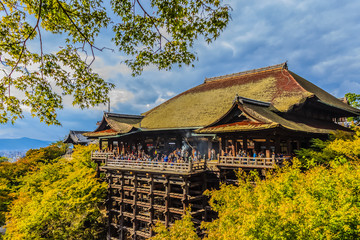 Beautiful landscape view of Kiyomizu-dera Temple with green trees and blue sky, Kyoto, Japan