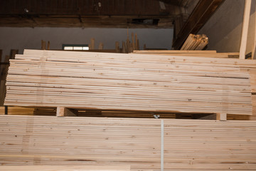 Wooden boards in a stack. Pine boards. A lot of lumber.