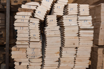 Lumber butts. Boards clad in piles. Euro race, blockhouse, timber emitation.