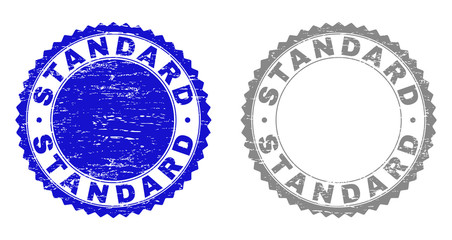 Grunge STANDARD stamp seals isolated on a white background. Rosette seals with grunge texture in blue and grey colors. Vector rubber stamp imprint of STANDARD text inside round rosette.