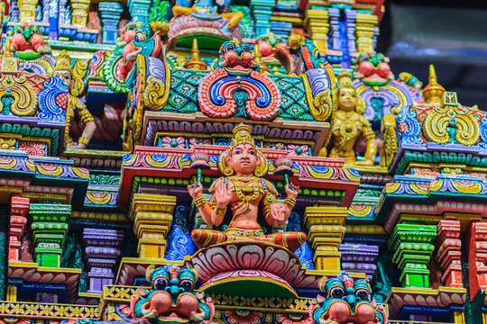 Colorful night view of indian gods sculpture at Sri Maha Mariamman Temple, also known as Maha Uma Devi temple, the public hindu temple in Silom, Bangkok, Thailand. It known as Wat Khaek Silom.