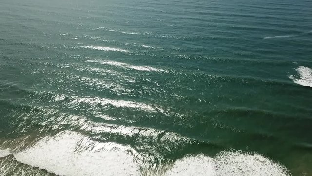 Drone footage of a beach called Barra de Ibiraquera in Imbituba, Brazil.