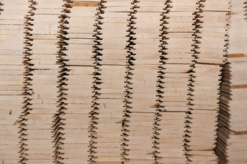 Lumber butts. Boards clad in piles. Euro race, blockhouse, timber emitation.