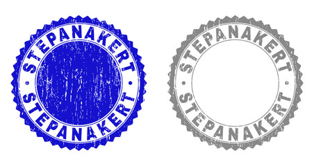 Grunge STEPANAKERT stamp seals isolated on a white background. Rosette seals with grunge texture in blue and grey colors. Vector rubber stamp imitation of STEPANAKERT caption inside round rosette.