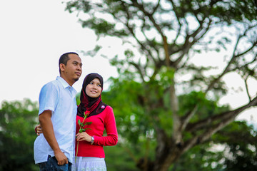 A young couple spend their time together at park to enjoy the day
