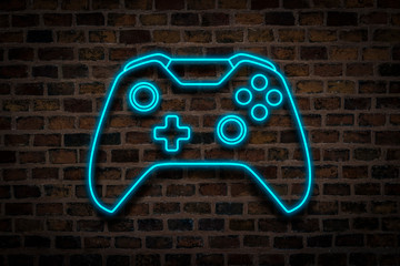 Joystick or Gamepad, Neon sign on a brick wall background. Computer games concept, tournament