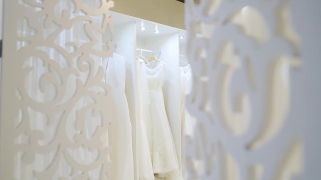 Wedding salon with white lace dresses