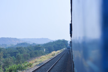 Looking outside the moving train in india 