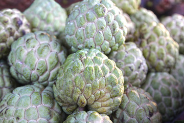 Tropical fruit green Annona on the counter of the market.