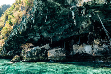 A wooden pier at the Viking cave, on the shore of Maya Island, part of Phi Phi islands in Andaman Sea, Thailand