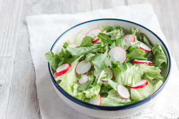 Dietary food for fitness. Radish, Lettuce and Arugula Salad