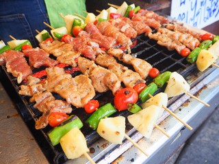 Pork and chicken barbecue on stick selling in the market as Thai famous street food