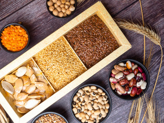 Healthy food nutrition dieting concept. Assortment of high vitamin E sources. nuts, seeds, beans, buckweat, lentils, chickpea, Healthy fats