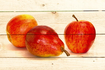 The image of apples and pears on the texture of planed boards.