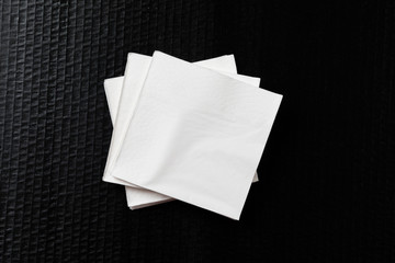 Paper napkin on black background.