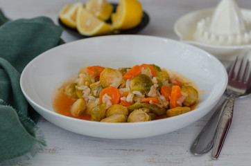 Brussels sprouts with olive oil, lemon ,carrots and rice