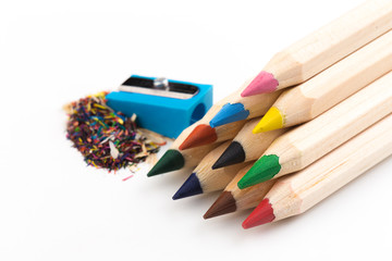Fototapeta premium Wooden colorful pencils isolated on a white background, pencil sharpeners.