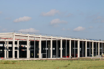 Obraz premium factory construction site with workers industry