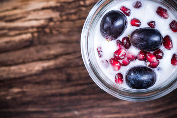 Natural yoghurt and fruits dessert in jar