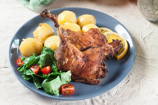 Duck legs confit with orange and salad