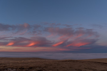 sunset in the mountains on the background of mount Elbrus. pink sky.