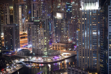 Fototapeta na wymiar Skyscrapers in Dubai Marina by night, Dubai, United Arab Emirates