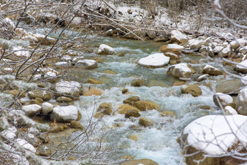 river in the mountains. mountainous area. photo on a long exposure, cloudy day.  waterfalls in the...