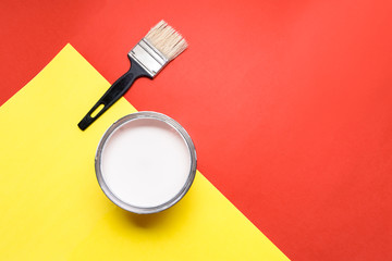 White Paint Can with Brush Top View On Yellow Background.