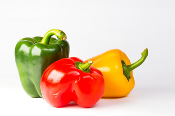 three peppers isolated on white background
