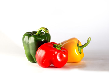 three peppers on white background