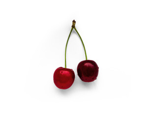 Two red cherries, fruits, white background with water drops.