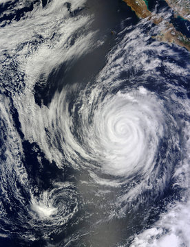 Satellite View an hurricane close to the U.S. West coast.  Elements of this image furnished by Nasa.